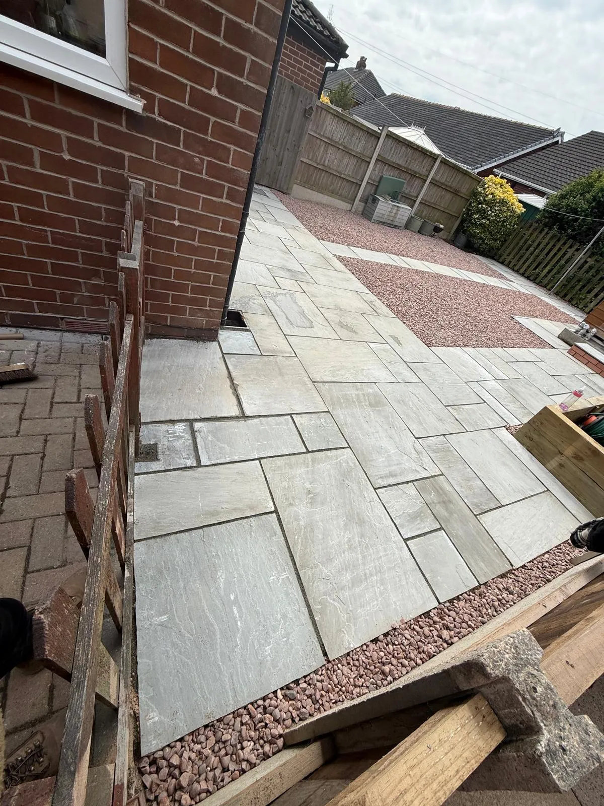 Sandstone side path with red gravel