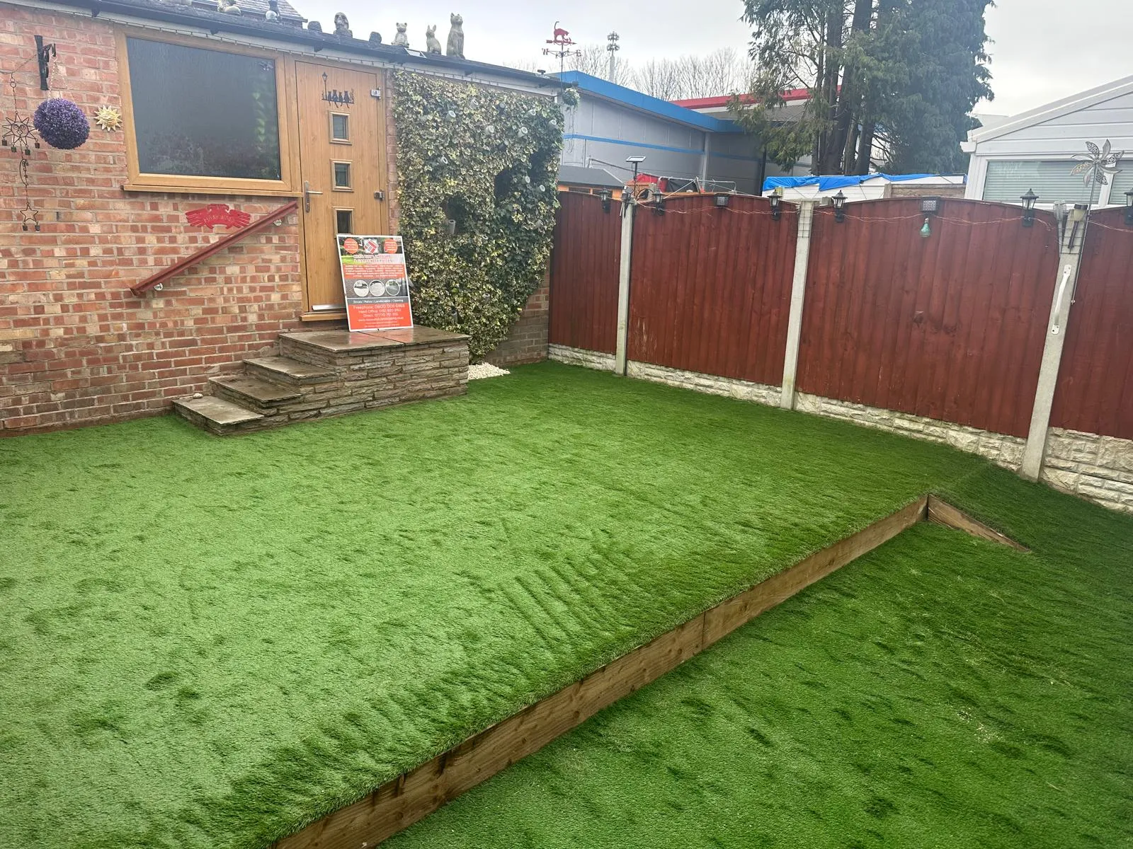 Artificial lawn with a sleeper edge