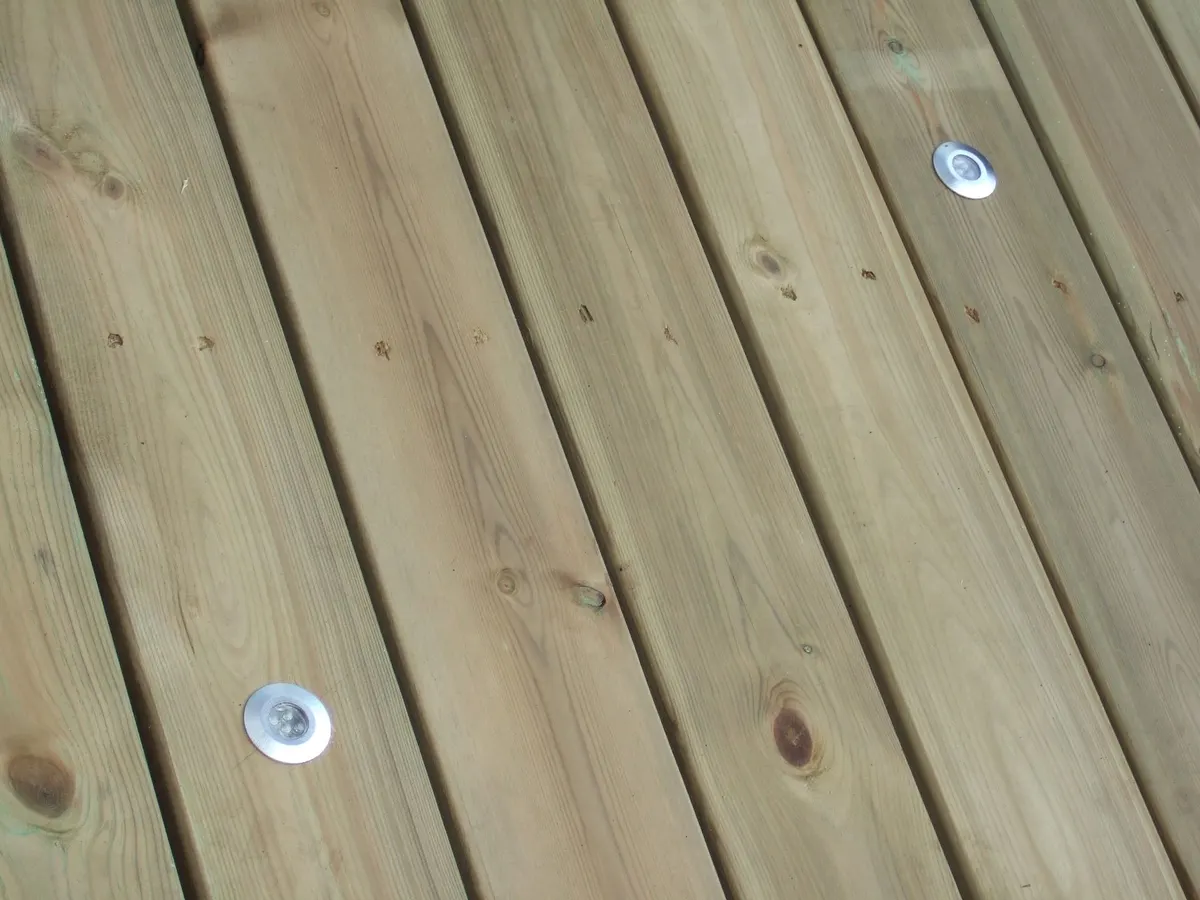Softwood deck boards with inset lights